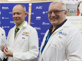 Doctors David Stojdl, left, and John Bell are investigating the cancer-fighting potential of the Maraba virus