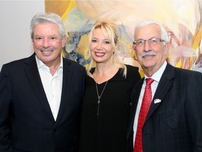 From left, John Ruddy, executive chairman of Trinity Development Group and founder of Trinity Development Foundation, with Ottawa Art Gallery director and CEO Alexandra Badzak and Lawson Hunter, chair of both the gallery's board of directors and its capital campaign, at the OAG on Tuesday, November 29, 2016, for the announcement of a $1.5-million donation by Ruddy and his wife.