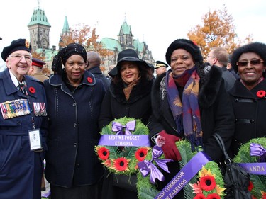 From left, Zimbabwean Ambassador Florence Chideya, dean of the Diplomatic Corps in Ottawa, Ethiopian Ambassador Birtukan Ayano Dadi, Barbadian Ambassador  Yvonne Veronica Walkes, and Margaret Kyogire, deputy head of mission at the Ugandan High Commission, took part in the Remembrance Day ceremonies at the National War Memorial Nov. 11. On their left is 88-year-old Korean War veteran Alice Milmore, who has been volunteering at the Remembrance Day ceremonies for more than 30 years.