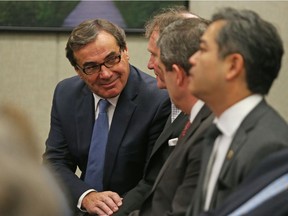 Graham Bird (L), Cyril Leeder (2nd from L) and other members of the RendezVous LeBreton group celebrate their selection to be the preferred proponent and enter into formal negotiations with the NCC at the NCC board meeting in Ottawa, November 24, 2016.