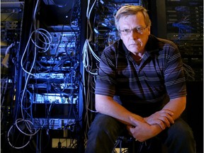 Grant Smith, a senior technical specialist with public works and government services, sits amidst a tangle of wires in a government data centre in Ottawa.