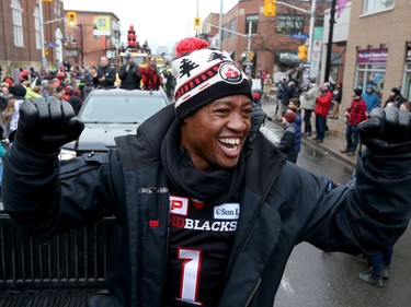 Ottawa RedBlacks Henry Burris having a great time with some fans on Bank Street during the 2016 Grey Cup Parade in Ottawa Tuesday Nov 29, 2016.