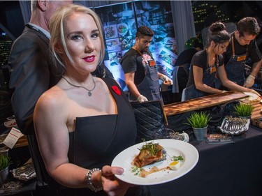 Guest Erica Leslie with a plate of Braised Oxtail with Crispy Dumpling from Michael Blackie at NeXT as ten Ottawa area chefs compete in the annual Gold Medal Plates competition and fund raiser for the Canadian Olympic Organization.   Wayne Cuddington/ Postmedia