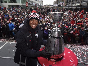Ottawa Redblacks Henry Burris touches the Grey Cup following a rally celebrating the team's victory over the Calgary Stampeders, Tuesday, Nov. 29, 2016 in Ottawa.
