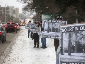 A group protests the city's plan to run an LRT flyover through Connaught Park in the Stage 2 LRT expansion after 2018.