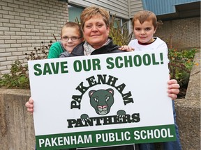 Jennifer Downey, mother of Austin, left, who is in Grade 3, and  Tristan, right, who is in Grade 1, are trying to save their school, Pakenham Public School from closing at the end of this school year, part of a plan to shut 29 schools at the Upper Canada District School Board.