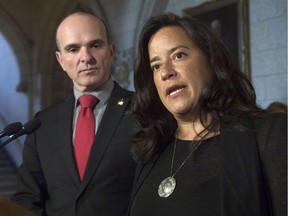 MP Randy Boissonnault looks on as Minister of Justice and Attorney General of Canada Jody Wilson-Raybould speaks with the media during a news conference in Ottawa, Tuesday November 15, 2016. Prime Minister Justin Trudeau named Boissonnault his special adviser on LGBTQ2 issues.
