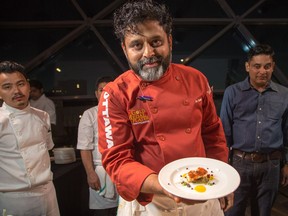 Joe Thottungal of Coconut Lagoon prepares plates of Poached Halibut as ten Ottawa area chefs compete in the annual Gold Medal Plates competition and fund raiser for the Canadian Olympic Organization.   Wayne Cuddington/ Postmedia