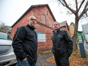 Josh Zaret (L) and Neil Zaret of Gemstone Developments during a tour of an old house located at 234 O'Connor that they want to demolish and eventually replace.