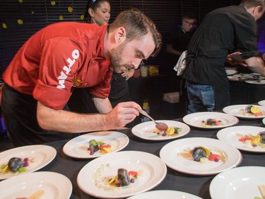 Kevin Benes of Carben Food + Drink prepares plates Cured Black Cod as ten Ottawa area chefs compete in the annual Gold Medal Plates competition and fund raiser for the Canadian Olympic Organization.   Wayne Cuddington/ Postmedia