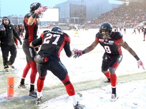 Kienan Lafrance (27) of the Ottawa Redblacks celebrates his late touchdown with Ernest Jackson (9) against the Edmonton Eskimos during second half of the CFL's East Division Final held at TD Place in Ottawa, November 20, 2016.