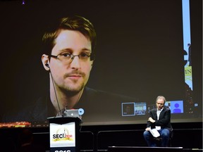 Edward Snowden _ who blew the whistle on mass surveillance – speaks via video link to a recent cybersecurity conference.