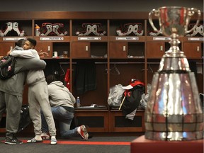 Ottawa Redblacks Moton Hopkins gets a hug from Jonathan Rose after clearing out their lockers at TD Place in Ottawa Wednesday Nov 30, 2016.