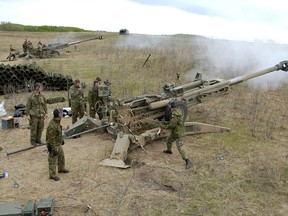 Gunners fire two M-777 155 mm guns during Exercise MAPLE GUARDIAN in Wainwright, Alberta on May 13, 2007. Canadian Forces photo.