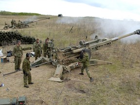 Gunners fire two M-777 155 mm guns during an exercise at CFB Wainwright, Alberta