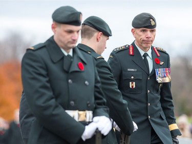 Major-General Wayne D. Eyre (R) presided over Remembrance Day ceremonies at Beechwood Cemetery.