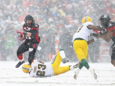 Marcell Young of the Edmonton Eskimos misses his tackle against Kienan Lafance of the Ottawa Redblacks during first half of the CFL's East Division Final held at TD Place in Ottawa, November 20, 2016.  Photo by Jean Levac  ORG XMIT: 125313