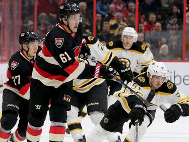 Mark Stone (left) races against Boston's Ryan Spooner during third-period action of the Ottawa Senators matchup against the Boston Bruins Thursday (Nov.4, 2016) at Canadian Tire Centre in Ottawa.
