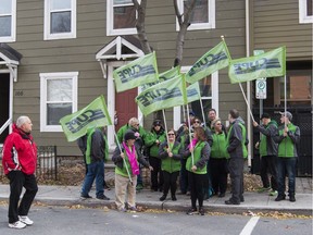 Members of CUPE Local 1974 protest outside of Montfort Renaissance on Murray Street in Ottawa on Thursday November 10, 2016.