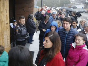 Crowds line up for a multifaith solidarity event at Congregation Machzikei Hadas synagogue in Ottawa on Saturday, November 19, in response to recent acts of hate vandalism.