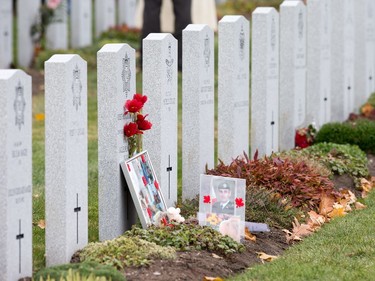 Mementos are left at grave sites as families, veterans, and military personnel attend Remembrance Day ceremonies at Beechwood Cemetery.