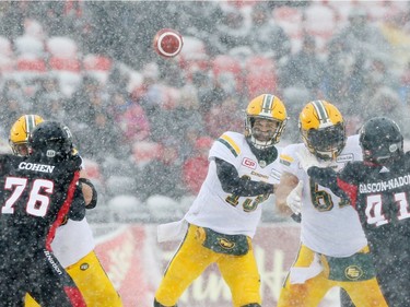 Mike Reilly of the Edmonton Eskimos throws against the Ottawa Redblacks during first half of the CFL's East Division Final held at TD Place in Ottawa, November 20, 2016.  Photo by Jean Levac  ORG XMIT: 125313