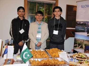 Muhammad Saleem, minister at the Pakistani high commission, centre, attended Rockcliffe Park's 90th Anniversary celebration in September at Rockcliffe Park Community Hall. Diplomats provided "A Taste of the World" buffet, featuring a sampling of international cuisine. He was joined by volunteers Zakriya (left) and Yahya Nasir.