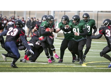 Franco-Cité's Lion-Ard'Eau Lymontard attempts to break a tackle.