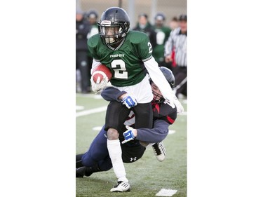 St. Mark's Grant Harrison tries to tackle Fanco-Cité's Jamesson Dominique.