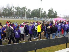 Marchers in Russell raised $50,000 Saturday for Jonathan Pitre's living expenses and other costs.