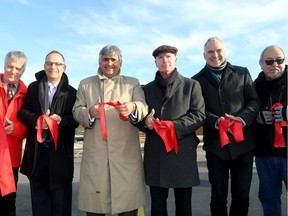 Old CFB Rockliffe was officially opened for new home sales Monday (Nov. 28, 2016) with a ribbon cutting that included (from left): Tartan Homes co-owner Ian Nicol; Jean Lachance, Sr., Dir. of Real Estate for Canada Lands Company; Claridge Homes founder Bill Maholtra; Uniform Developments co-founder John McDougall; city councillor Tobi Nussbaum; and Jerry Lavalley from Algonquins of Ontario.