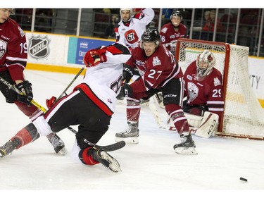 The action gets intense in front of Guelph Storm goalie Liam Herbst.