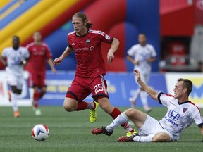 Ottawa Fury FC's Lance Rozeboom, left, gets past Indy Eleven's Brad Ring, right, during the second half of play at TD Place Stadium Sunday, August 28, 2016. (Darren Brown/Postmedia) Assignment 1123720