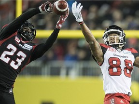 Ottawa Redblacks defensive back Forrest Hightower (23) makes an interception on a pass intended for Calgary Stampeders slotback Kamar Jorden (88) during fourth quarter CFL Grey Cup action Sunday, November 27, 2016 in Toronto.