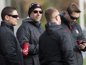 Ottawa Redblacks GM Marcel Desjardins (2nd from left) and staff on the sidelines during a team practice at TD Place Stadium on Thursday November 10, 2016.