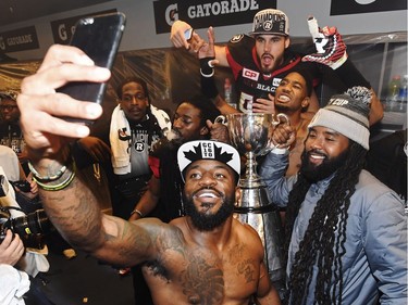 Ottawa Redblacks players take a selfie in their locker room as they celebrate their Grey Cup win over the Calgary Stampeders in Toronto on Sunday, November 27, 2016.