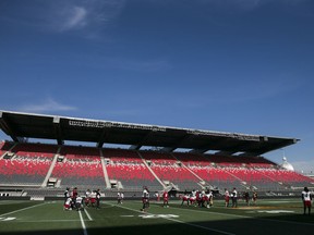 Files: Ottawa Redblacks players take to the field at TD place for a team practice .