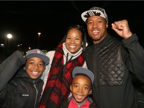 Ottawa Redblacks quarterback and Grey Cup champion Henry Burris arrived in Ottawa by train on Monday with his wife, Nicole, and sons Armand, 10, and Barron, 7.