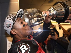 Ottawa Redblacks quarterback Henry Burris (1) takes a drink from the cup as the Redblacks celebrate their Grey Cup win over the Calgary Stampeders in Toronto on Sunday, November 27, 2016.