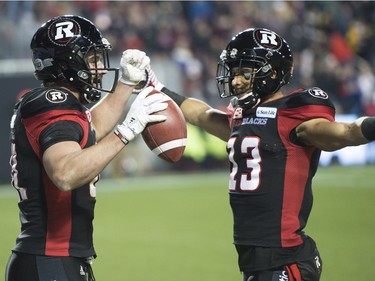 Ottawa Redblacks running back Patrick Lavoie (81) celebrates his touchdown with wide receiver Khalil Paden (13) touchdown during second quarter CFL Grey Cup football action against Calgary Stampeders on Sunday, November 27, 2016 in Toronto.