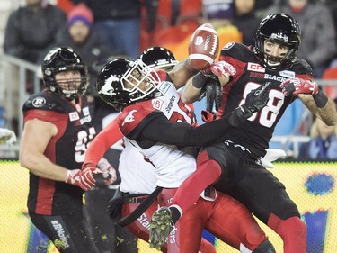 Ottawa Redblacks wide receiver Brad Sinopoli (88) can't make the catch on an onside kick by the Calgary Stampeders as Stampeders linebacker Glenn Love (36) defends during fourth quarter CFL Grey Cup action Sunday, November 27, 2016 in Toronto.