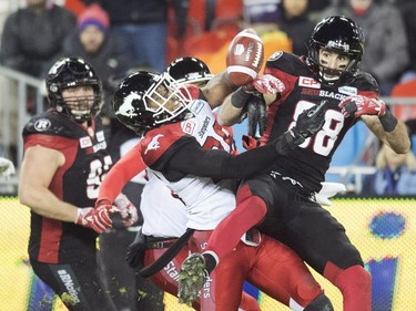 Ottawa Redblacks wide receiver Brad Sinopoli (88) can't make the catch on an onside kick by the Calgary Stampeders as Stampeders linebacker Glenn Love (36) defends during fourth quarter CFL Grey Cup action Sunday, November 27, 2016 in Toronto.