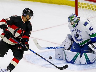 Ottawa Senators center Chris Kelly (22) looks for the rebound off of Vancouver Canucks goalie Jacob Markstrom (25) at Canadian Tire Centre in Ottawa on Thursday November 3, 2016. Errol McGihon/Postmedia