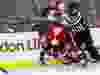 Ottawa Senators defenseman Cody Ceci (5) gets tangles up with Carolina Hurricanes left wing Viktor Stalberg (25) and linesman Greg Devorski (54) during NHL hockey action at Canadian Tire Centre in Ottawa on Tuesday November 1, 2016. Errol McGihon/Postmedia