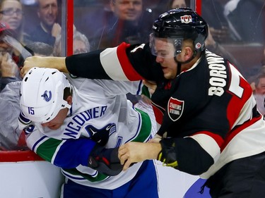 Ottawa Senators defenseman Mark Borowiecki (74) fights Vancouver Canucks right wing Derek Dorsett (15) at Canadian Tire Centre in Ottawa on Thursday November 3, 2016.