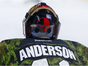 Ottawa Senators goalie Craig Anderson (41) waers a Hockey Fights Cancer sticker on the back of his mask during warmup on the 13th annual Canadian Forces Appreciation Night at Canadian Tire Centre before taking on the Carolina Hurricanes on Tuesday November 1, 2016. Errol McGihon/Postmedia