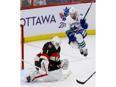 Ottawa Senators goalie Mike Condon (1) makes a save as Vancouver Canucks left wing Daniel Sedin (22) jumps in front of him at Canadian Tire Centre in Ottawa on Thursday November 3, 2016. Errol McGihon/Postmedia