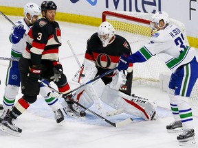 Ottawa Senators goalie Mike Condon (1) makes a save in action against the Vancouver Canucks at Canadian Tire Centre in Ottawa on Thursday November 3, 2016. a