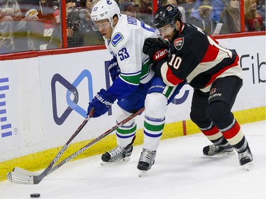 Ottawa Senators left wing Tom Pyatt (10) checks Vancouver Canucks center Bo Horvat (53) at Canadian Tire Centre in Ottawa on Thursday November 3, 2016. Errol McGihon/Postmedia