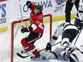 The Ottawa Senators' Mark Stone celebrates his goal on Los Angeles Kings goalie Peter Budaj as the Kings' Alec Martinez defends late in the third period.